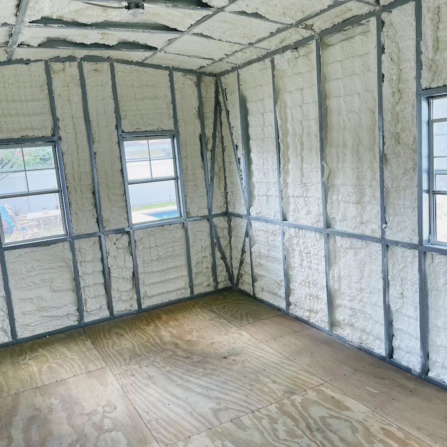Closed-cell spray foam insulation applied to wall cavities in a residential project in Delafield